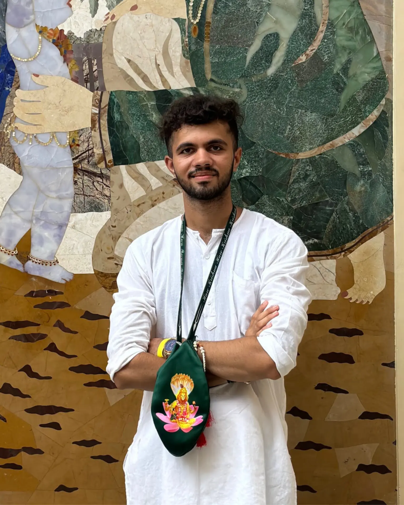 Satyajeet Jadeja standing before a marble deity relief